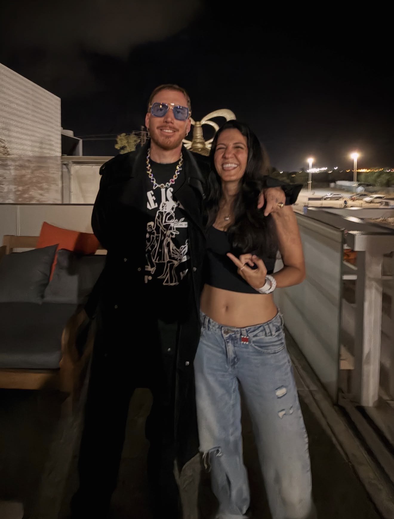 Sama backstage on a rooftop after a show